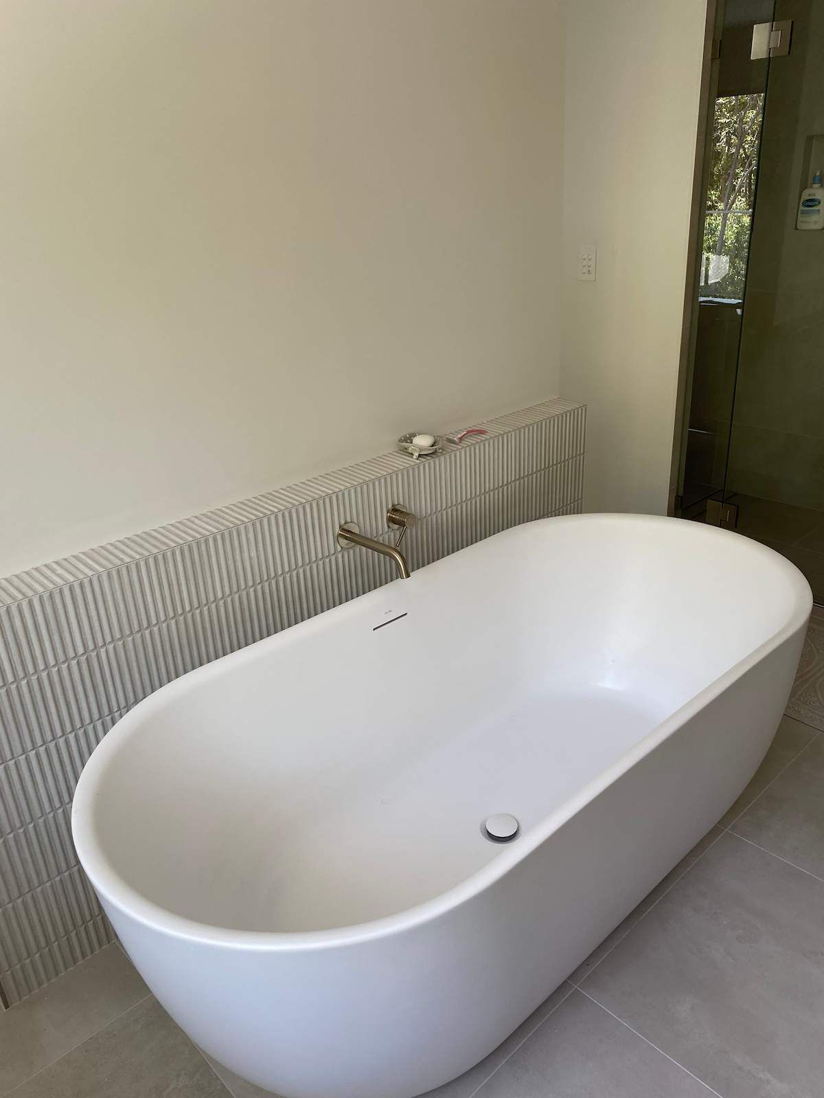 Bathroom With a White Freestanding Bathtub — Nick Hall Builder in Cooroy, QLD