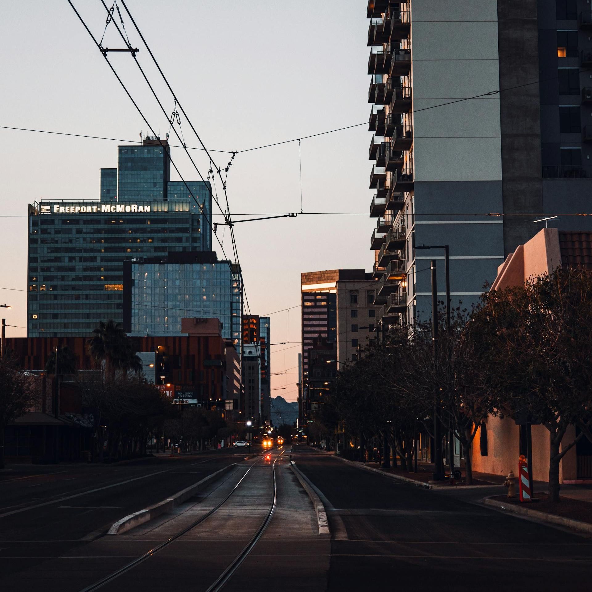 A city street with a lot of tall buildings