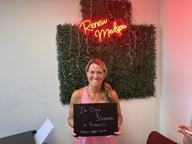 Woman showing down 33 pounds from medical weight loss treatments