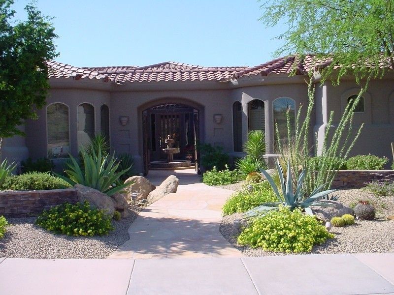 The front of a house with a walkway leading to it