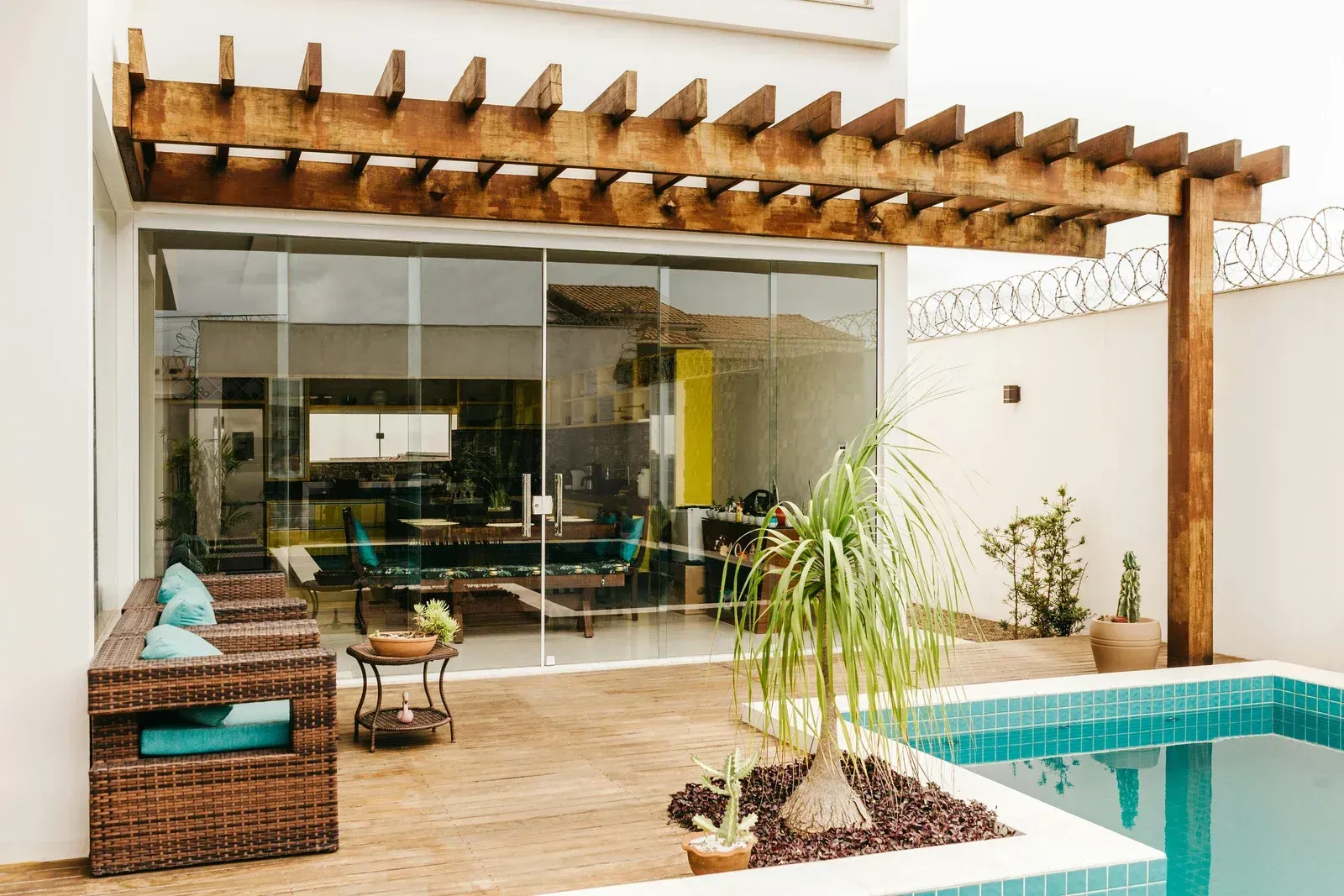 A patio with a pergola and stone steps