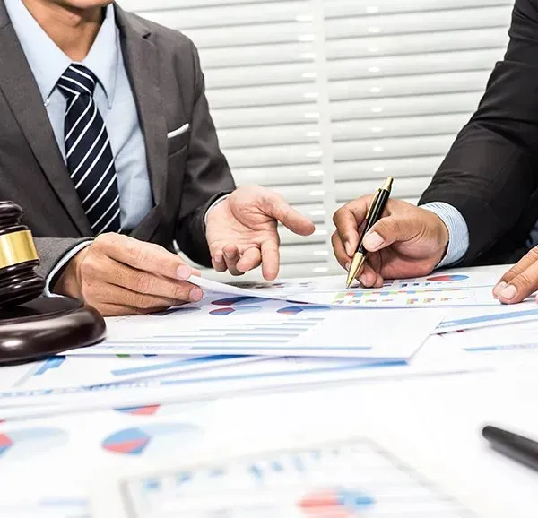 Two People in Suits Reviewing Documents — Nelson Keane & Hemingway Lawyers in Dubbo, NSW