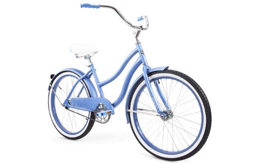 Light blue cruiser bike with white-walled tires and a white seat, on a white background.