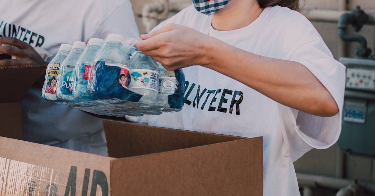 A person wearing a white t-shirt with the word
