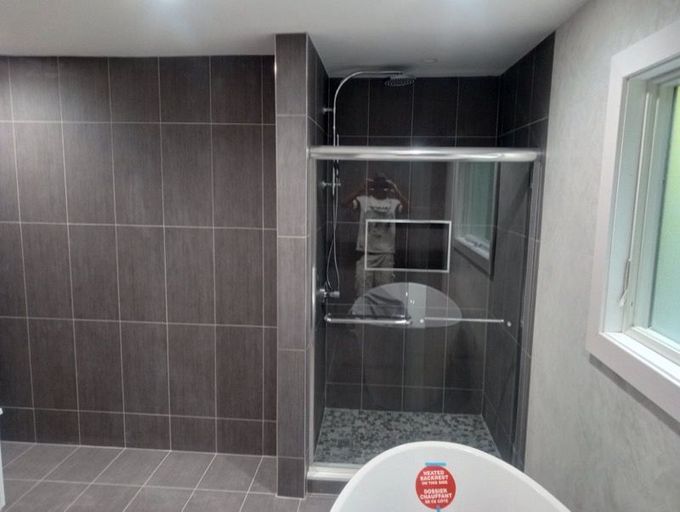 A room with a ladder and a fan in it