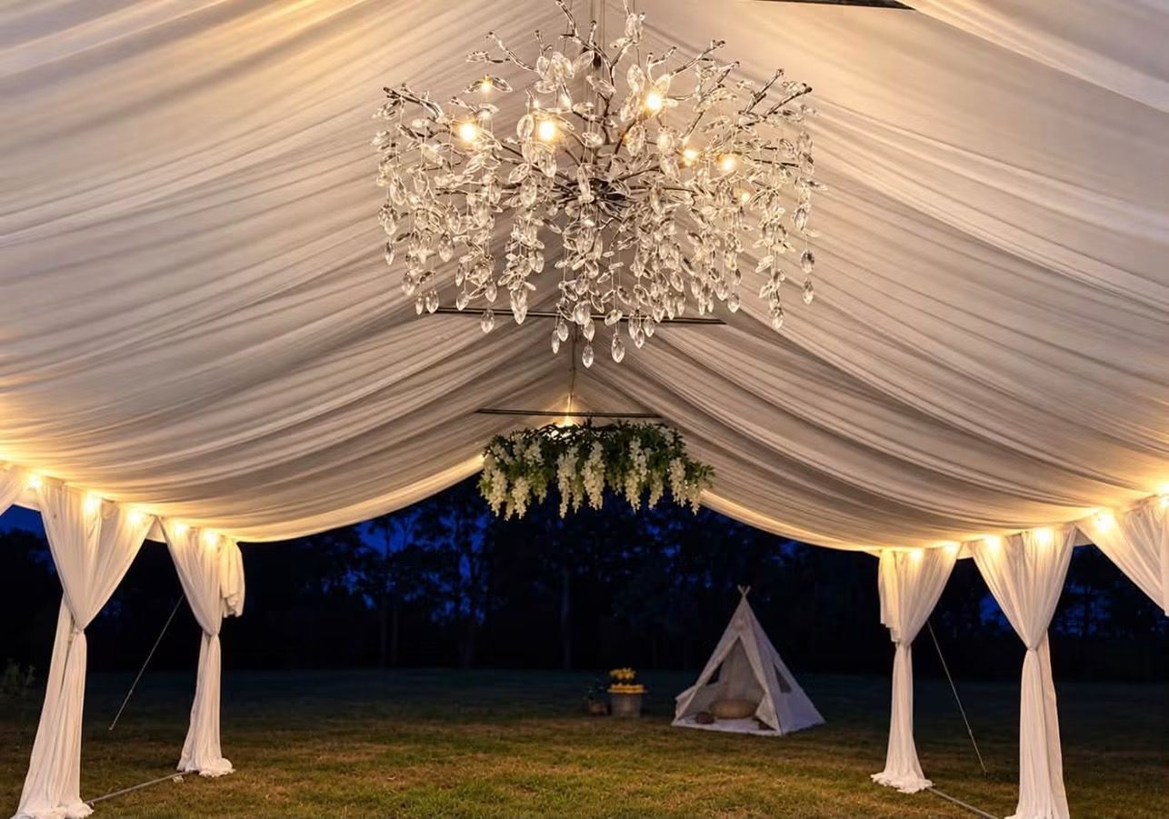 White wedding tent set up for an outdoor reception, Twin Lakes Party Rentals.