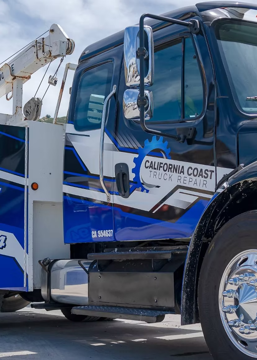 A blue and white tow truck with 