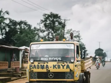 A yellow truck labeled 