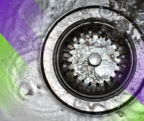 Water flowing into a stainless steel sink drain. Purple and green color overlay on the left.