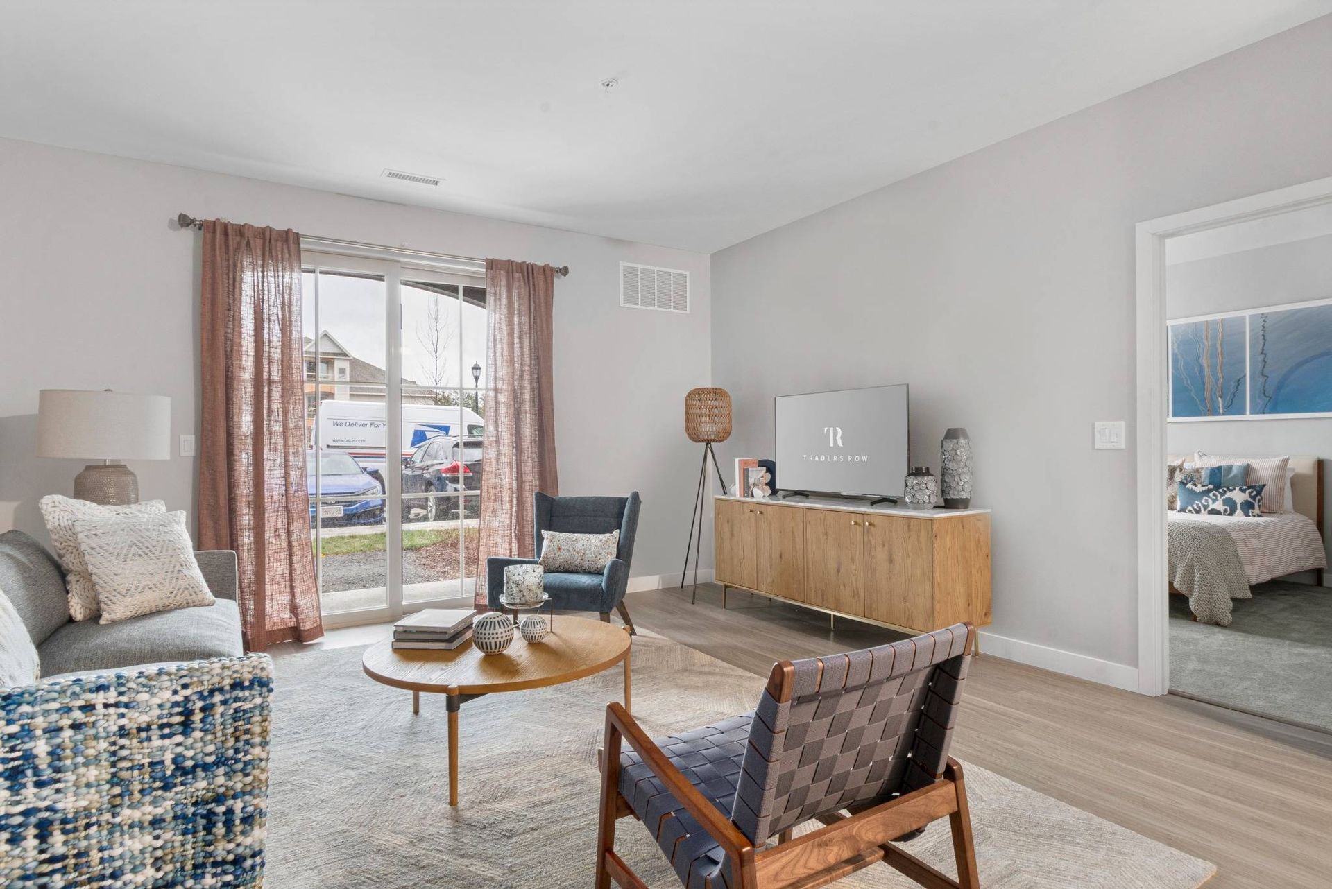 Spacious living room with balcony and beautiful views at Traders Row.