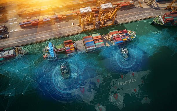 Aerial view of cargo ship at a port, surrounded by containers, with digital world map overlay.