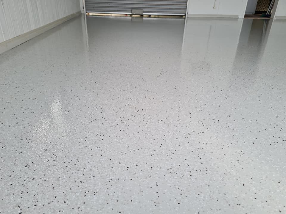 A Close Up of a White Concrete Floor in a Garage — Alan Aldridge Floor Sanding in Urraween, QLD