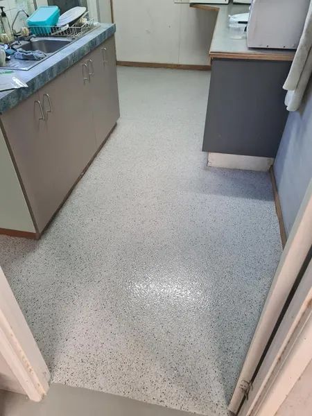 A Kitchen With a Sink and Cabinets and a White Floor — Alan Aldridge Floor Sanding in Maryborough, QLD
