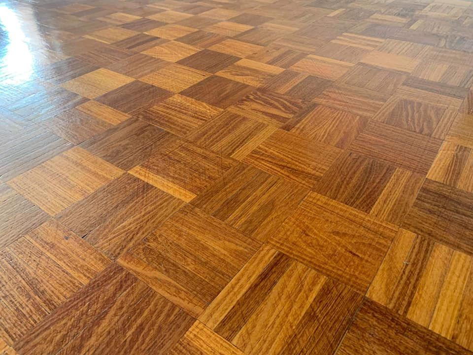 A Close Up of a Wooden Floor With a Checkered Pattern — Alan Aldridge Floor Sanding in Urraween, QLD