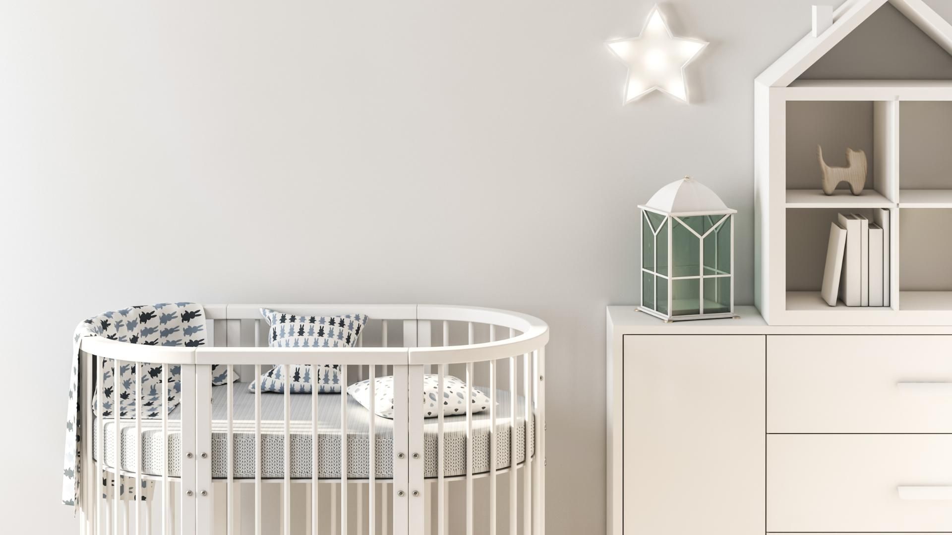 There is a crib in the middle of the room.