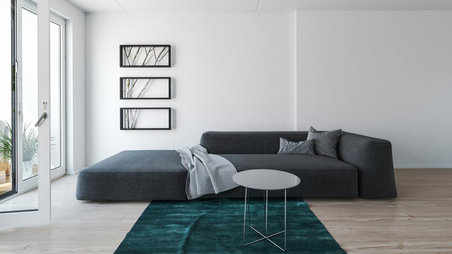 A living room with a couch , table , and rug.