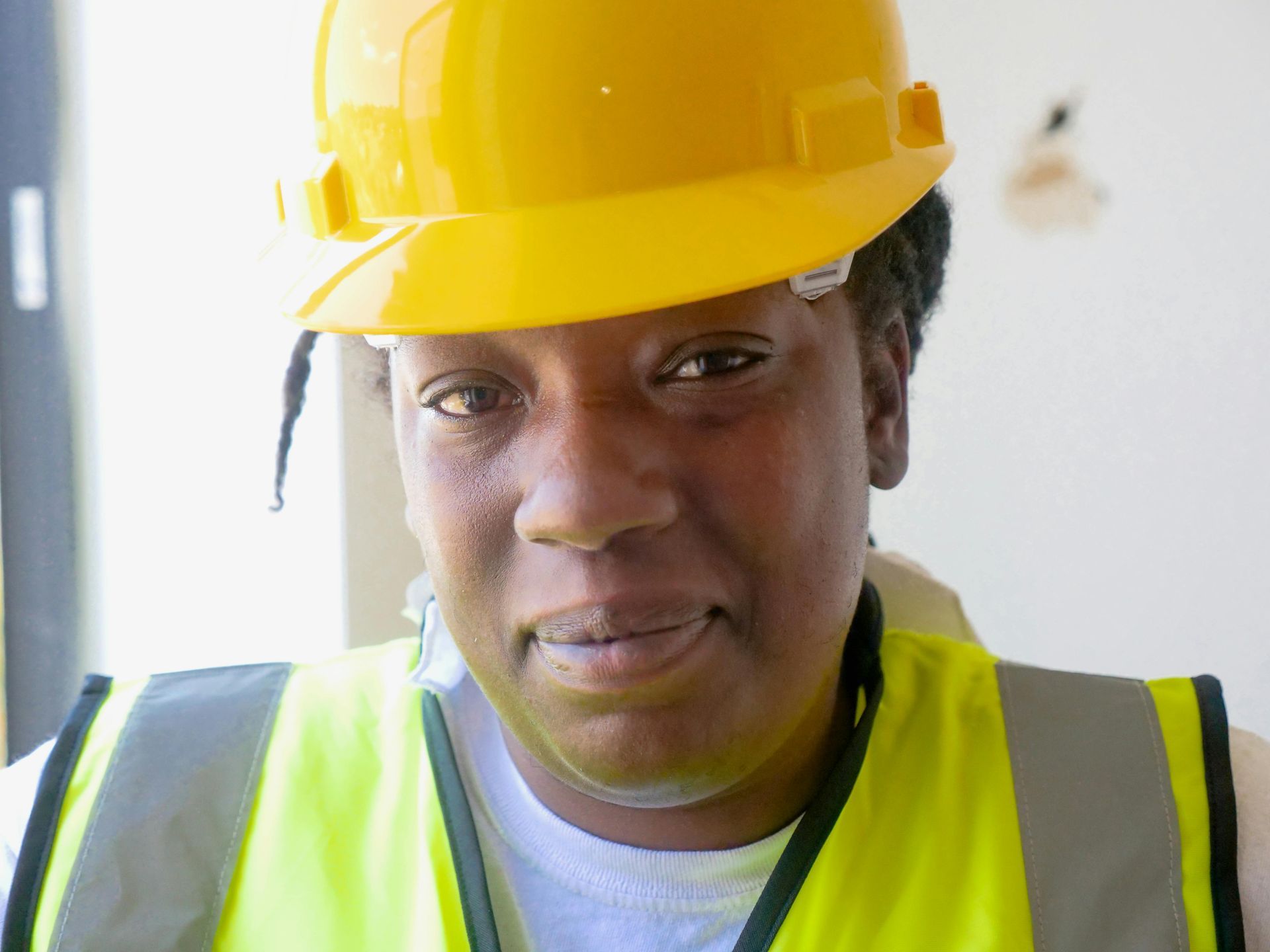 A warehouse working wearing safety equipment to prevent injuries and safety issues in the workplace.