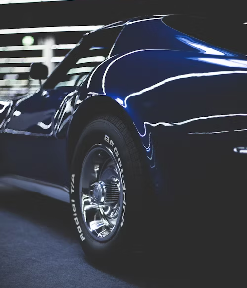 A blue car with a bfgoodrich tire on it