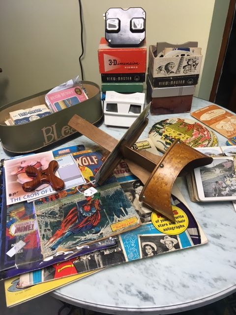 Assorted vintage cassette tapes and cases scattered on a round marble table