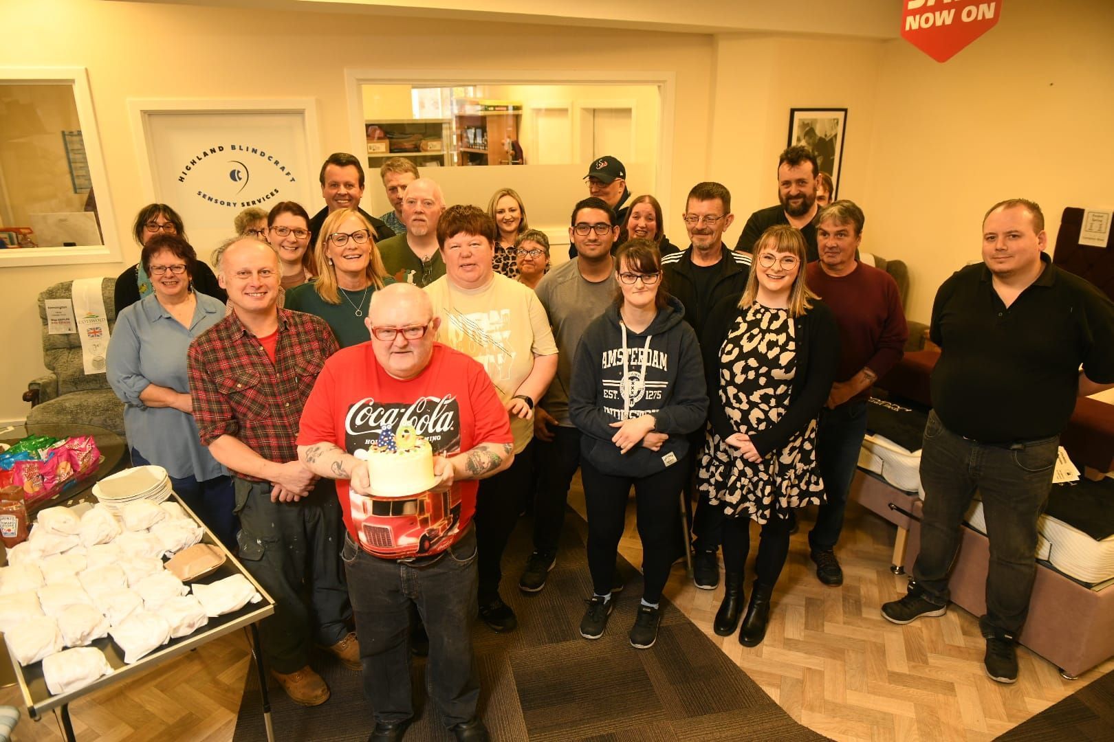 The full team smiling for an anniversary 