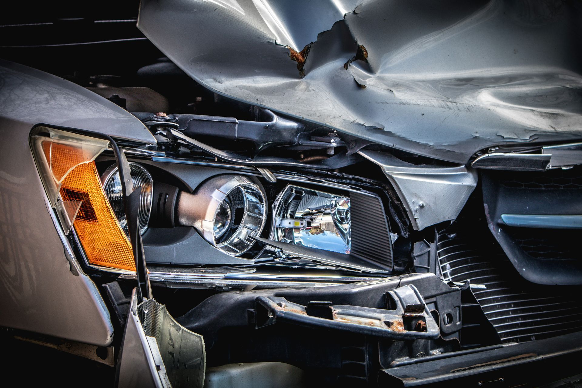 A close up of a car that has been damaged in an accident.