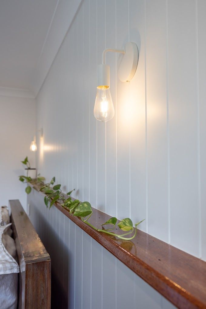 Empty Room With Hardwood Floors , White Walls and French Doors — Ironbark Built Townsville in Currajong, QLD