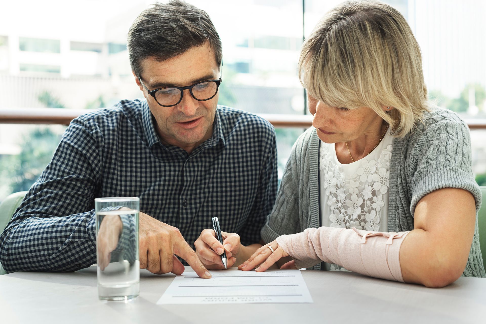 Caucasian couple reviewing legal healthcare documents at home