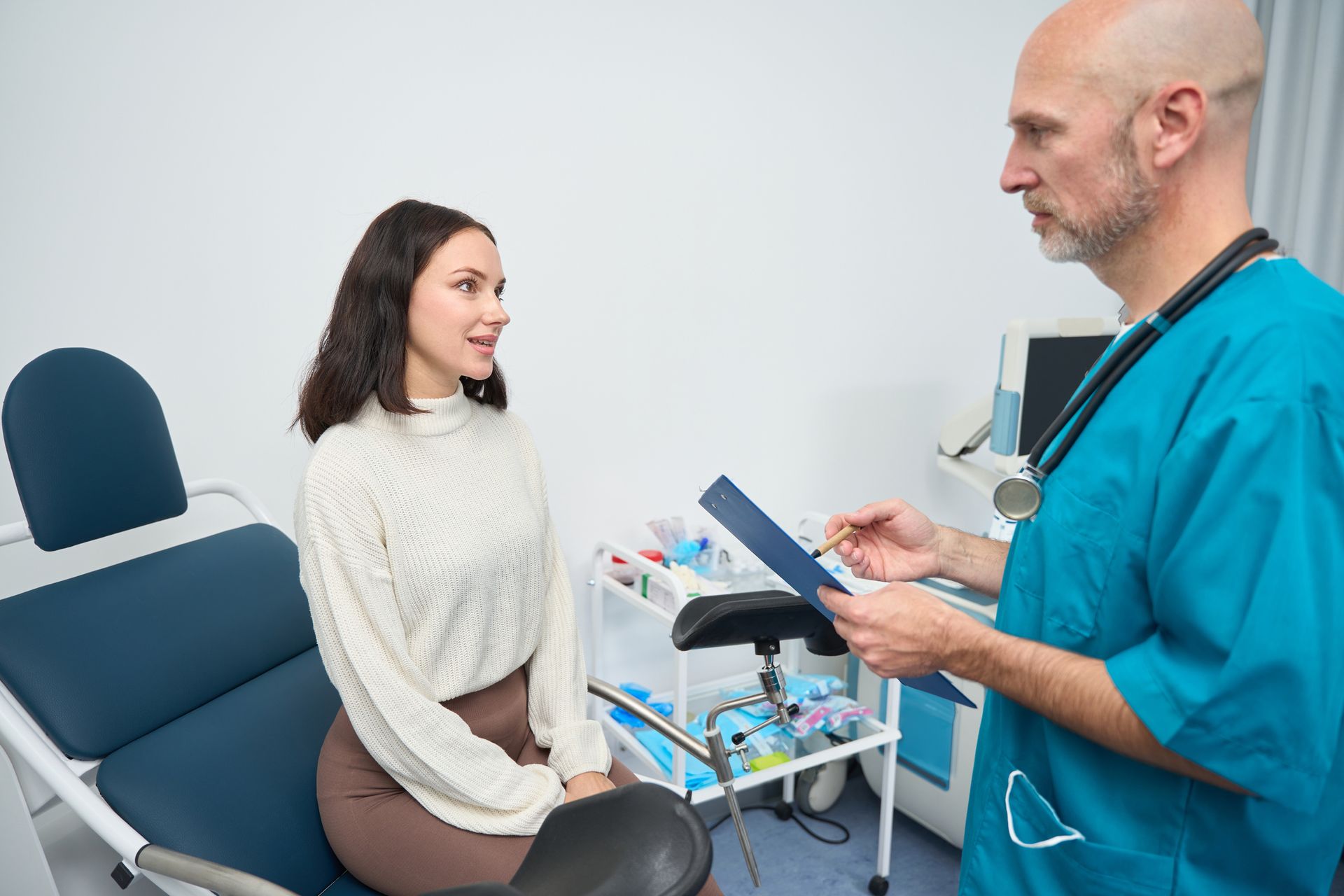 Woman Sitting In Gynecological Chair - San Antonio, TX - La Femme OB/GYN.