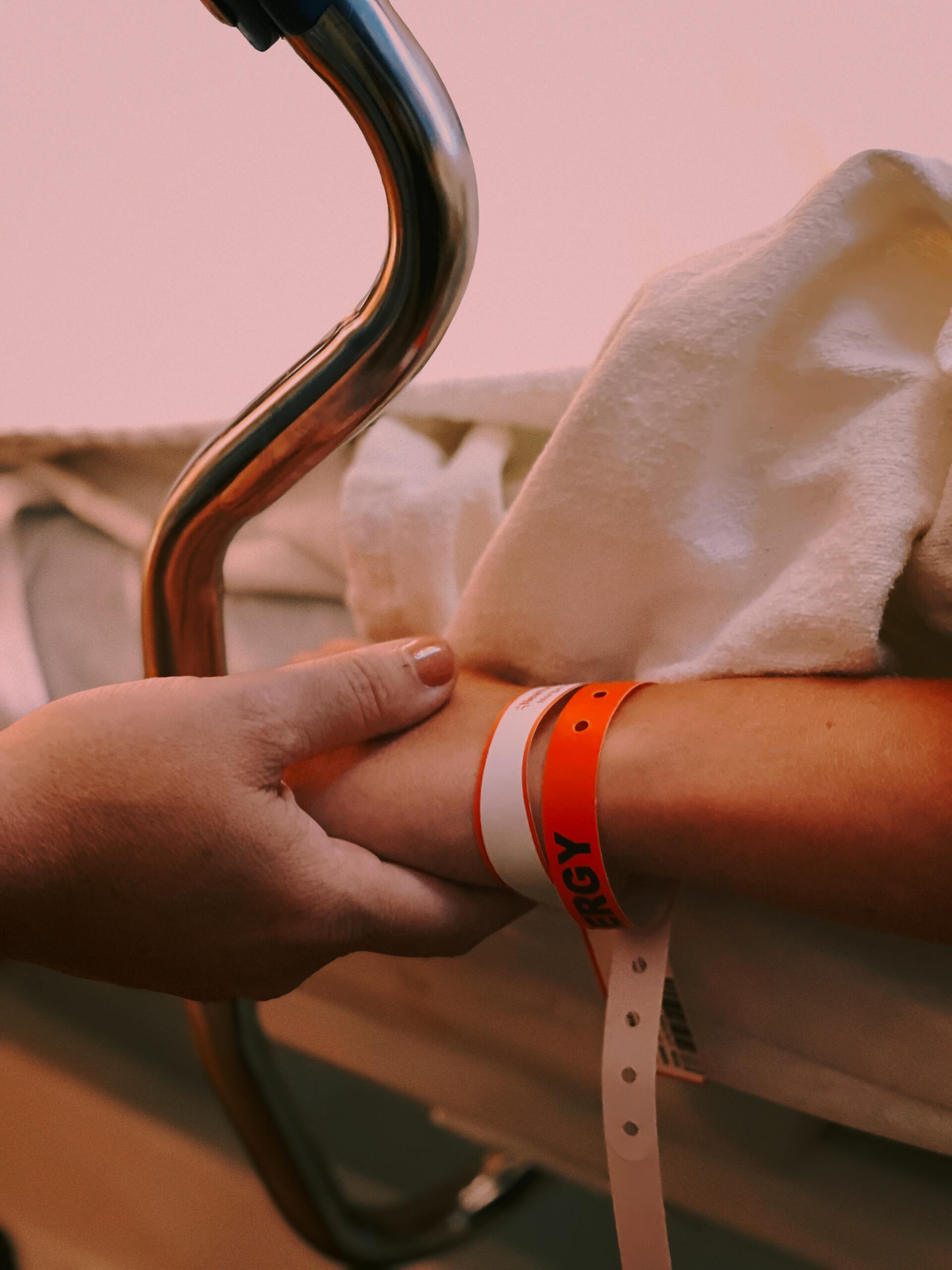 in hospital holding hands
