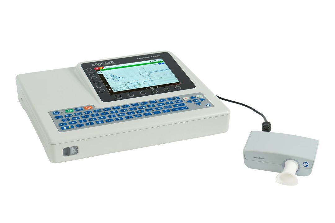 A white ecg machine with a small device attached to it.