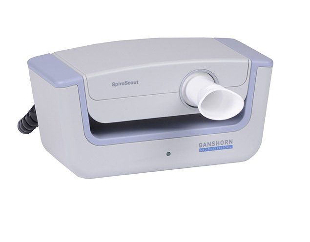 A device that looks like a printer with a hose attached to it.