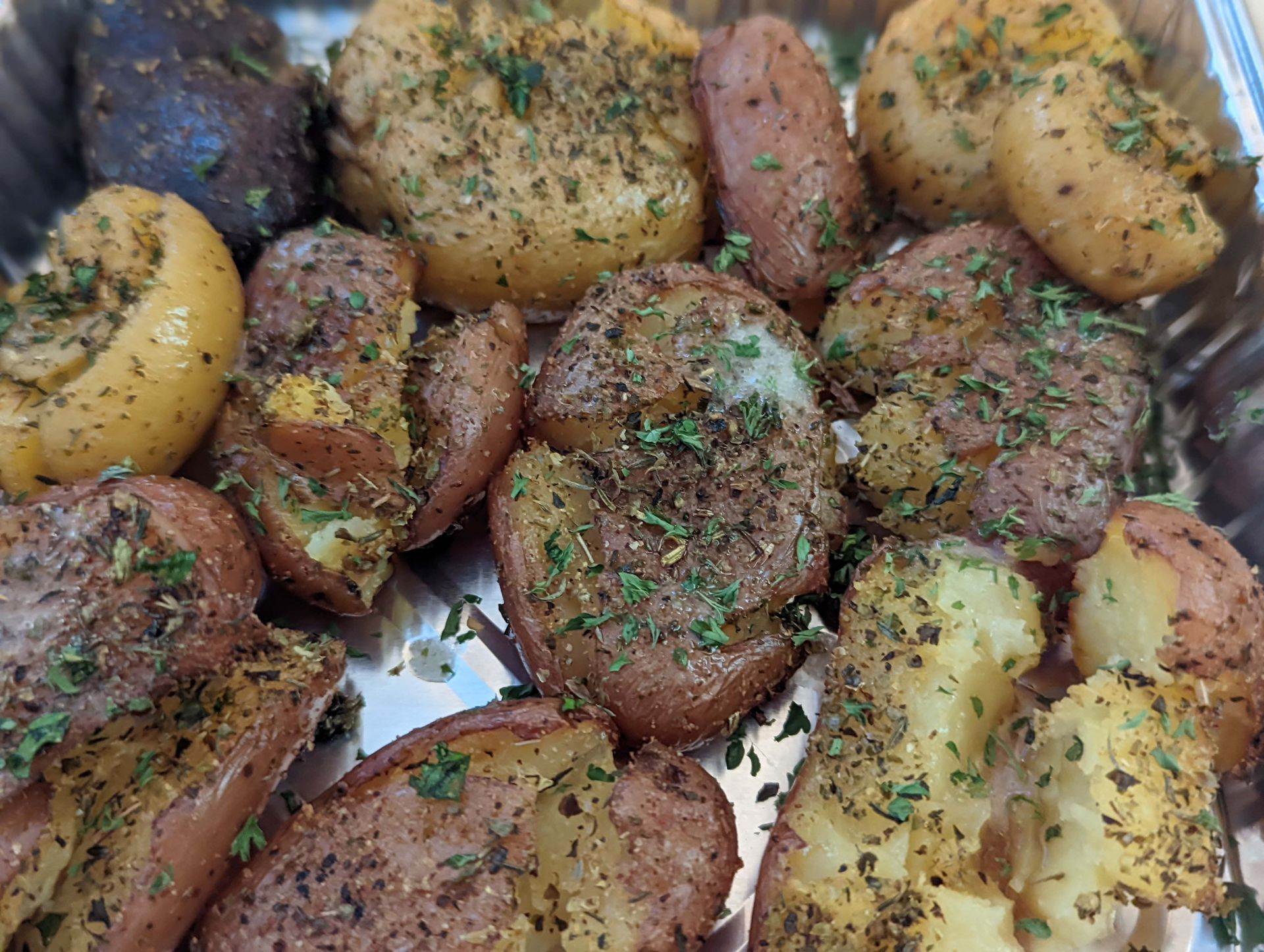 There are many different types of potatoes in this tray.