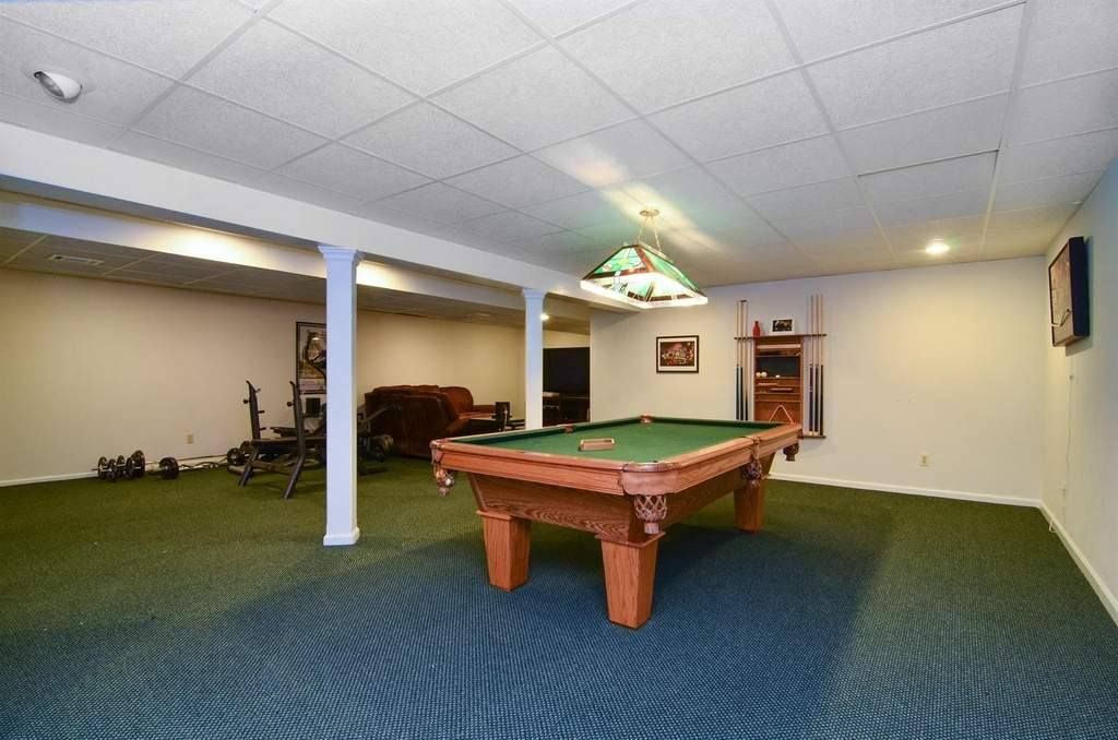 There Is A Pool Table In The Middle Of The Room