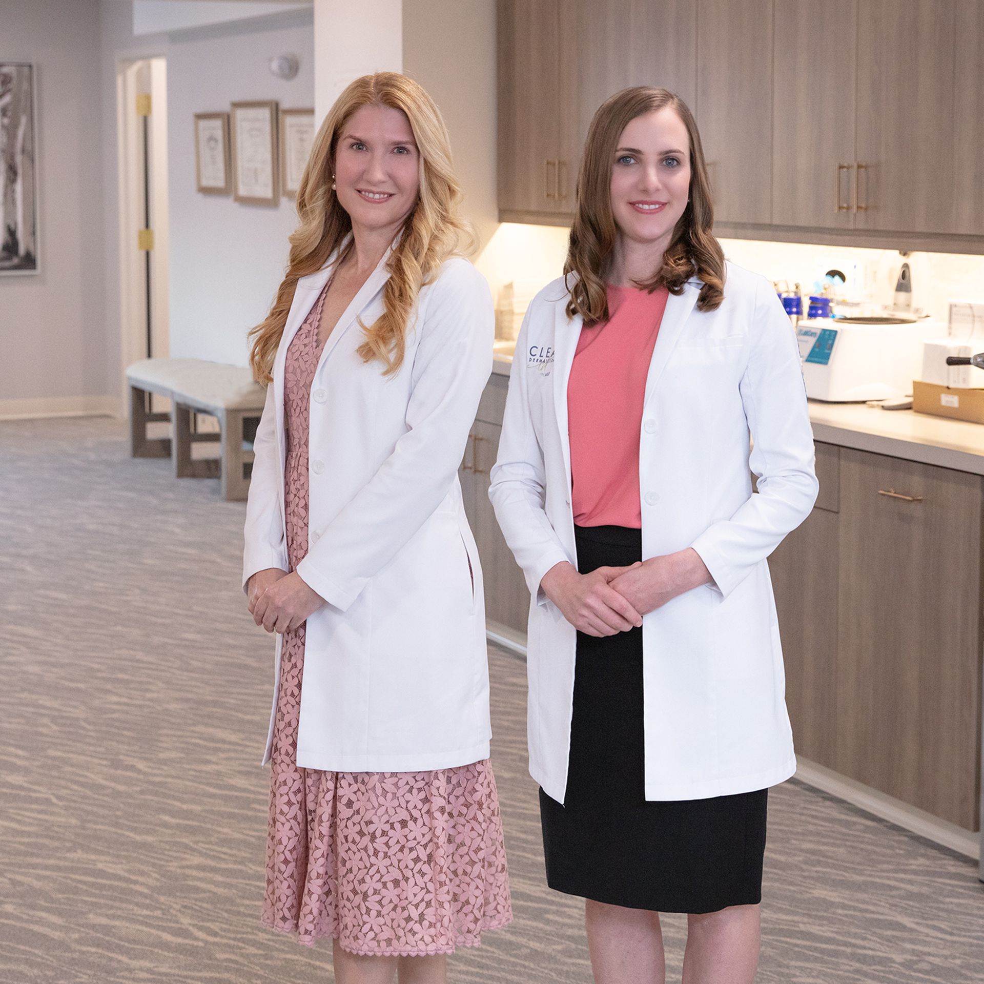 Dr. Mueller and staff member wearing white lab coats