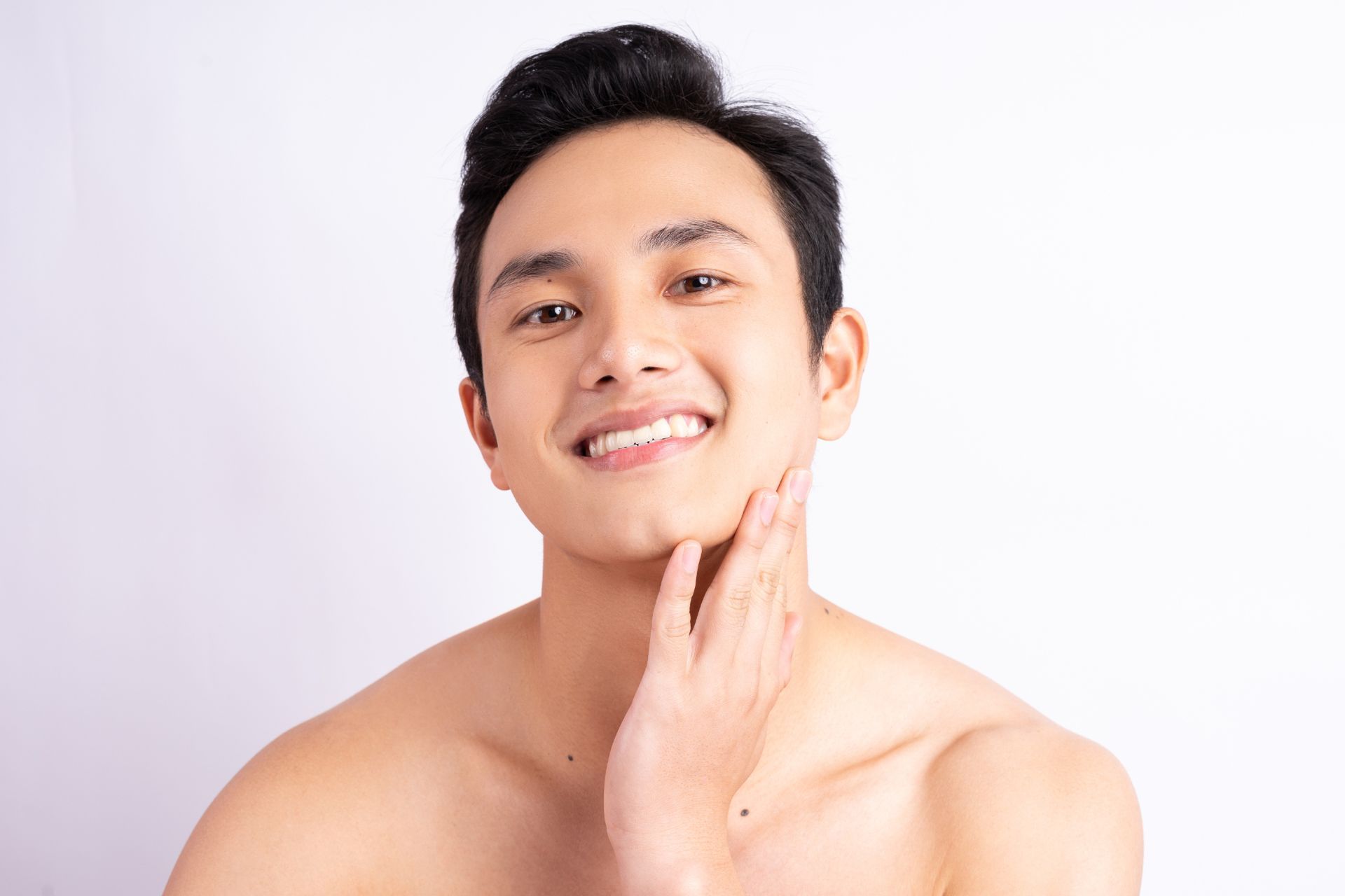 handsome young asian man with smooth skin after laser skin rejuvenation treatment