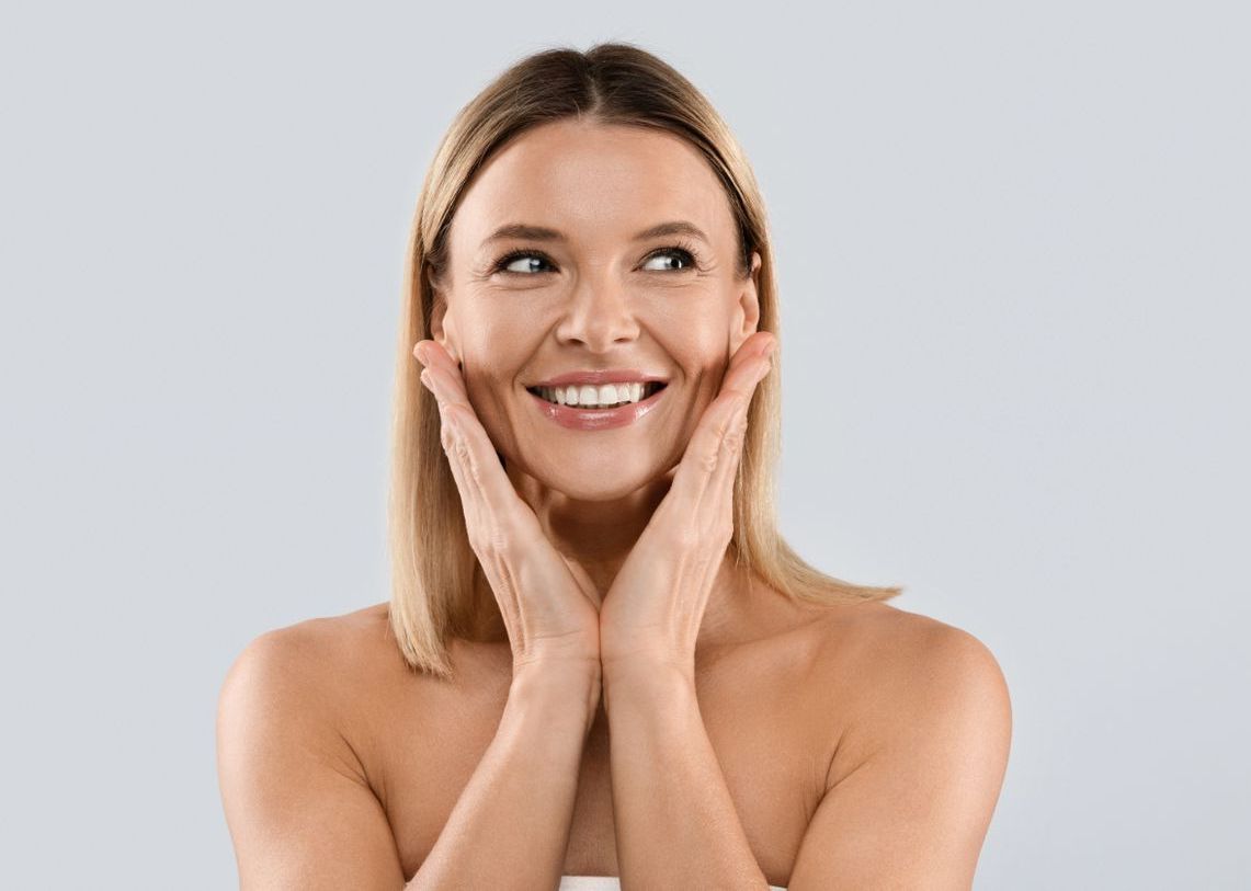 beautiful caucasian woman in her 40s with smooth even skin after IPL photorejuvenation skin treatment