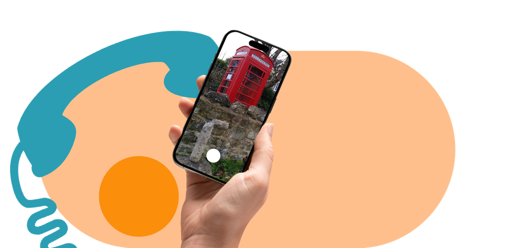 Hand holding a smartphone displaying a red phone booth over a colorful abstract background