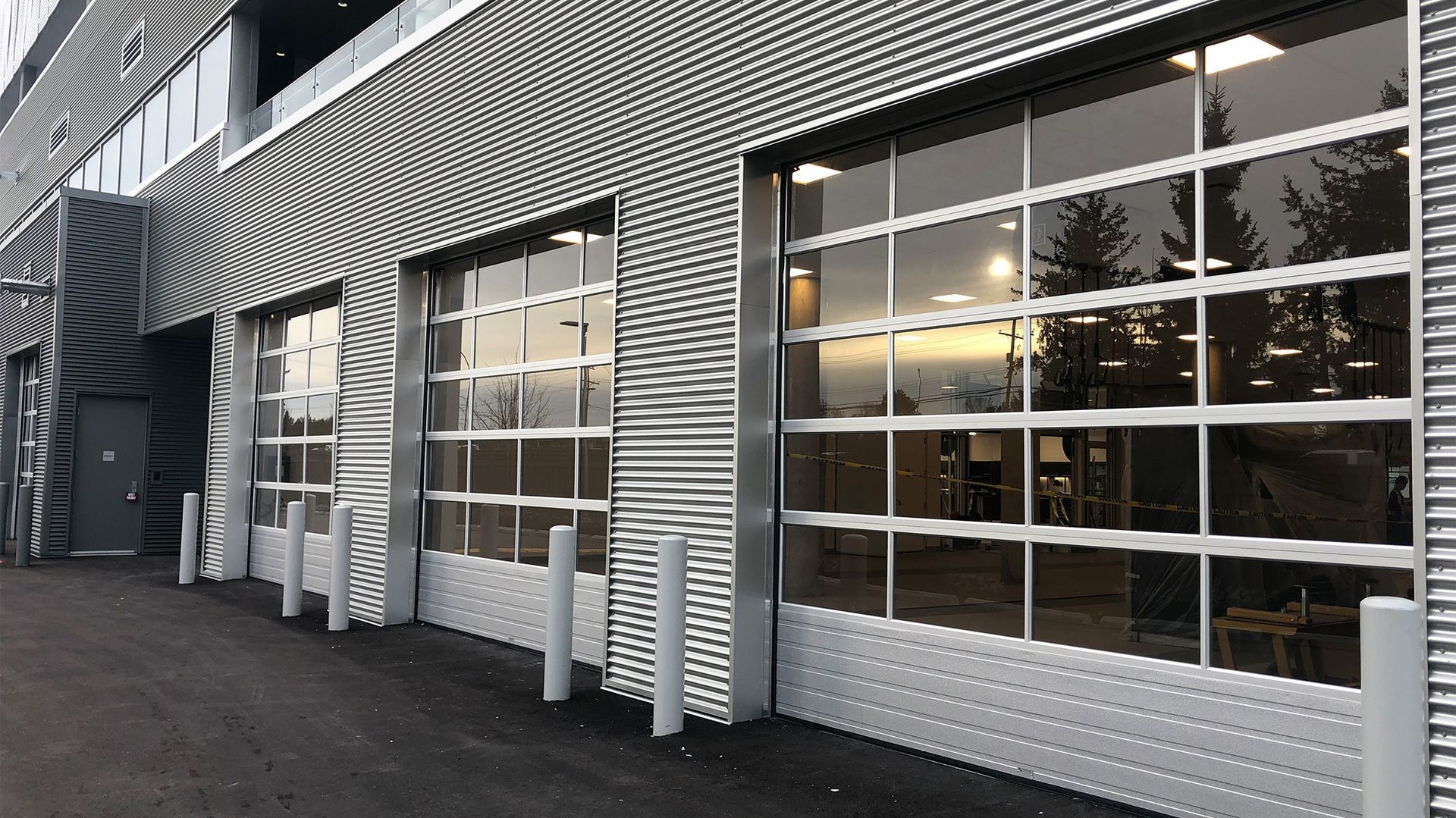 A row of garage doors on the side of a building.