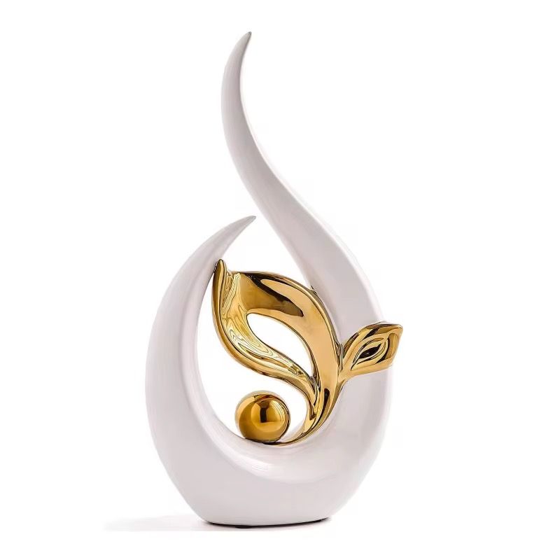 White and gold abstract floral sculpture with a smooth curved base on a white background
