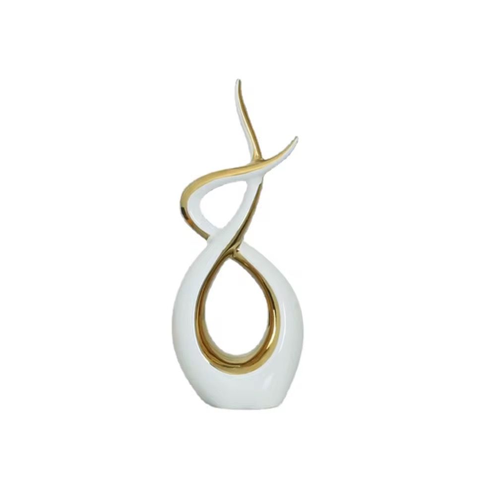 Abstract gold and white sculptural vase with looping curved design