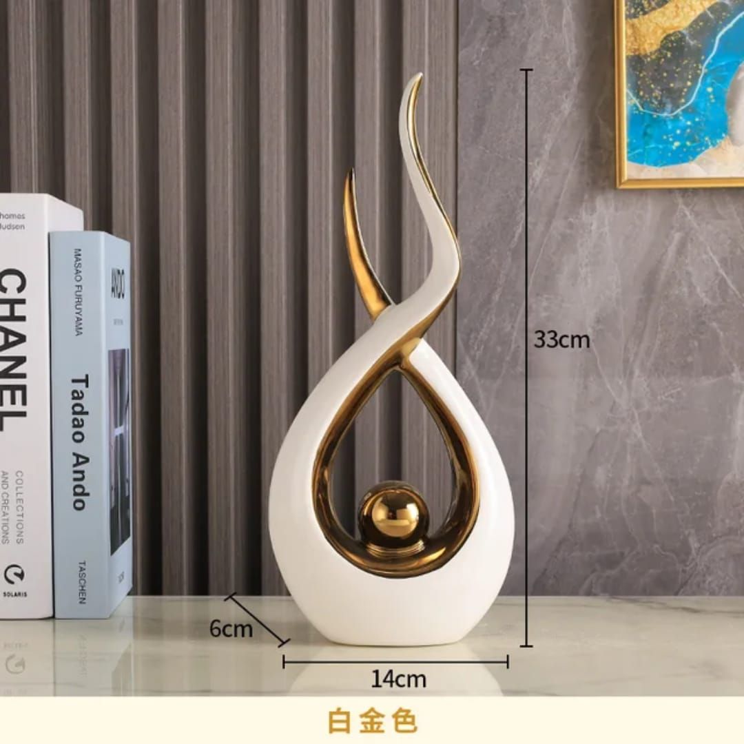 Gold and white abstract sculpture on a shelf, with 33 cm height labels shown.