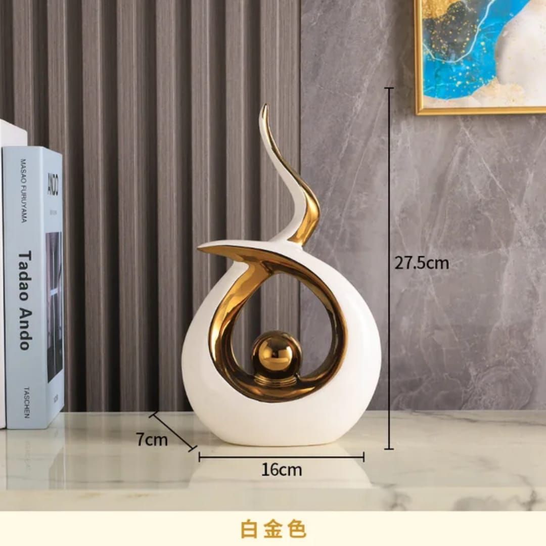 Gold and white abstract sculpture on a shelf, with 33 cm height labels shown.