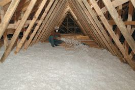 Attic skylight construction with yellow insulation between metal framing. Attic skylight construction with yellow insulation between metal framing.