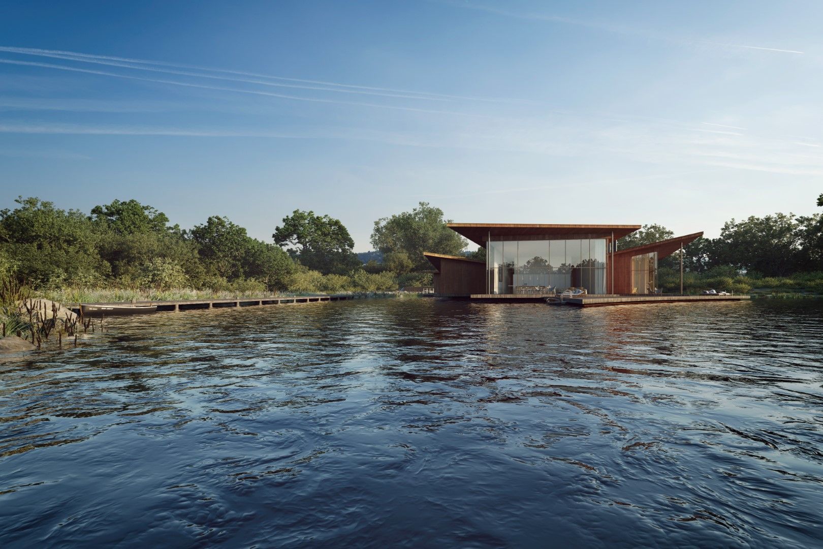 Modern house on a lakeshore with a red roof, surrounded by trees and calm water under a clear sky