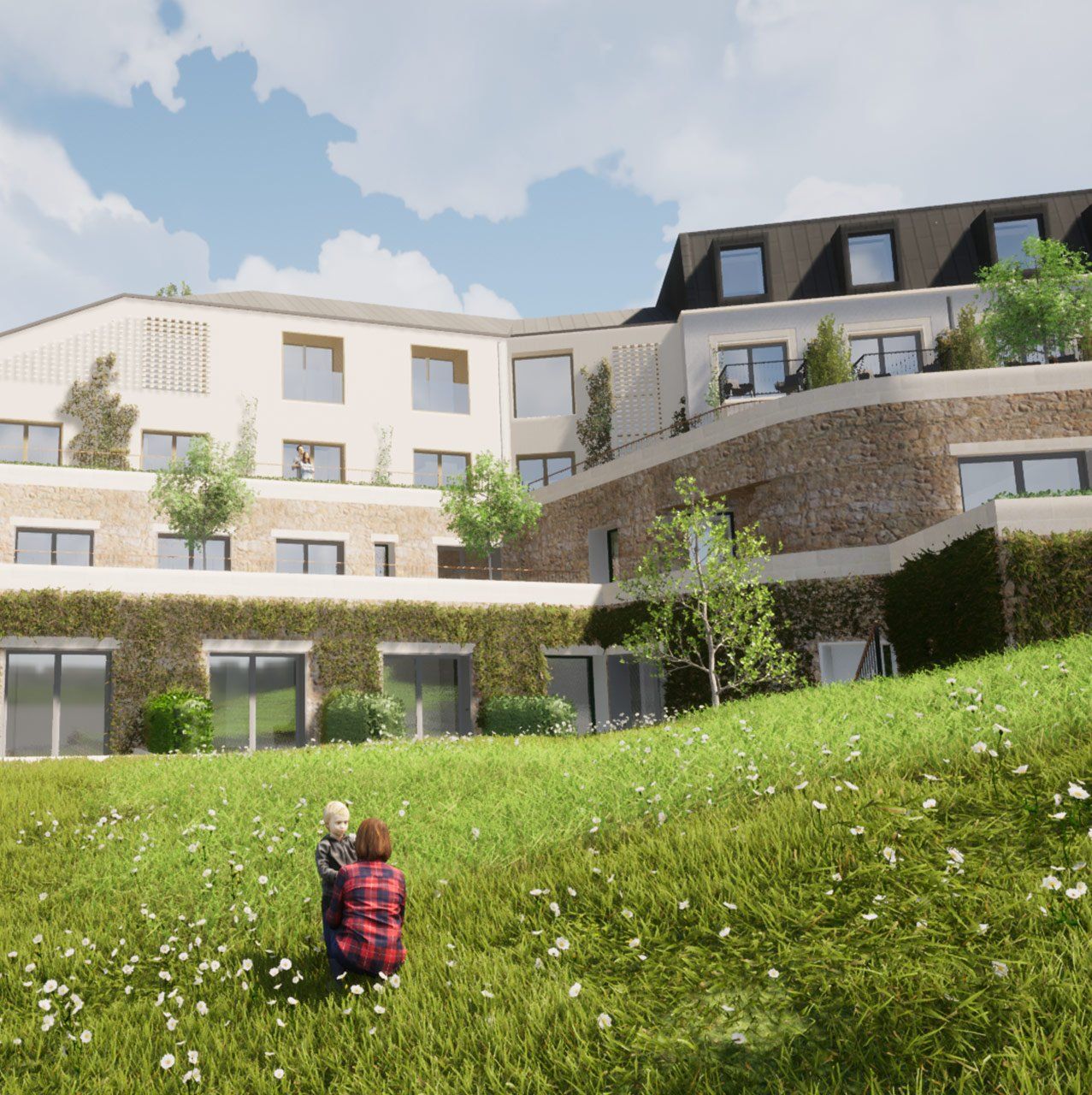 Child sitting in a green grassy courtyard facing modern apartment buildings