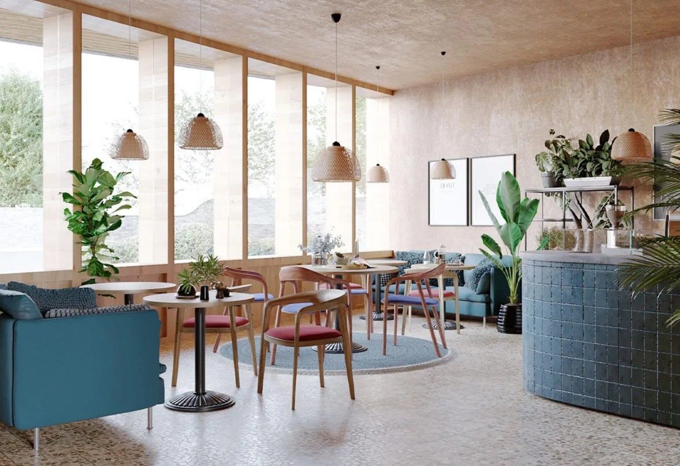 Bright, modern café interior with plants, wooden tables, woven pendant lights, and a blue upholstered sofa.