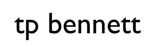 Black text reading “tp bennett” on a white background