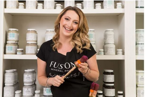 Happy Women Holding Paint Brush