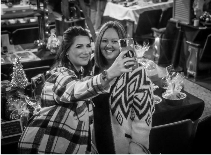 two women selfie black and white