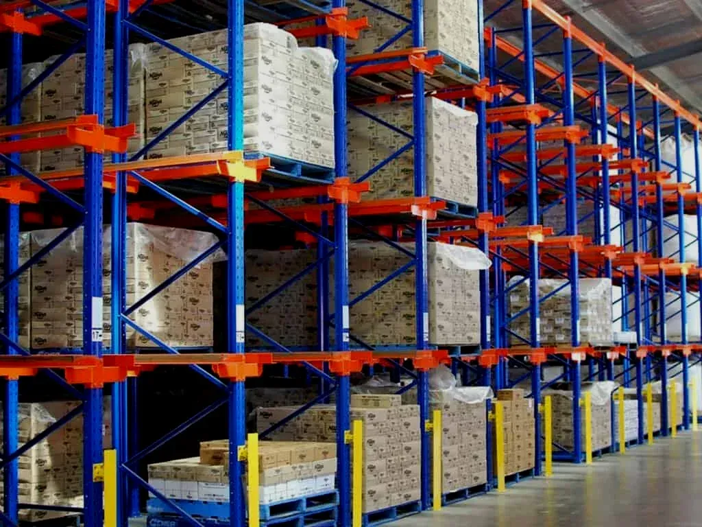 A large warehouse filled with lots of boxes and shelves.